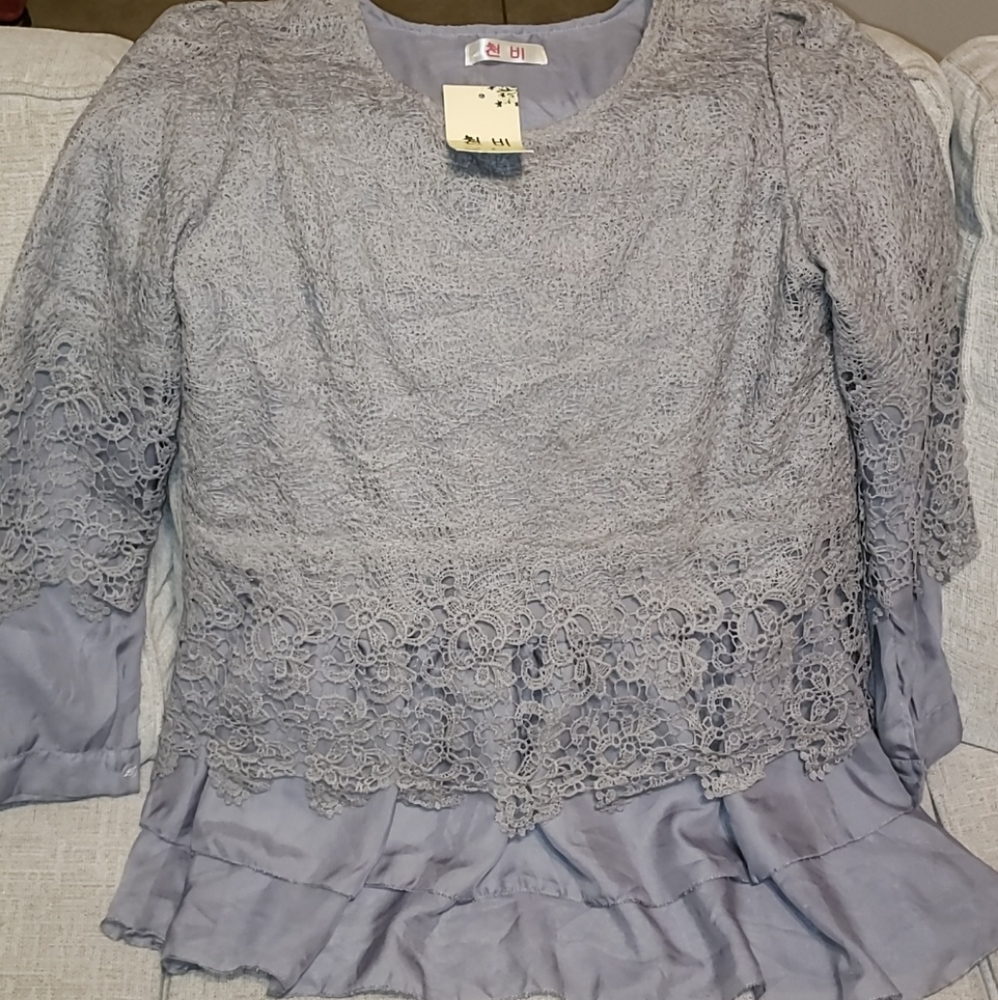 Top size XL fits like a small-med